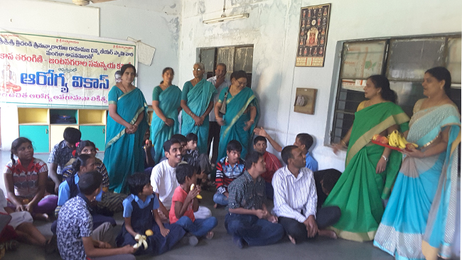 Women Health Welfare distributed fruits to the students of Radha Mentally challenged School