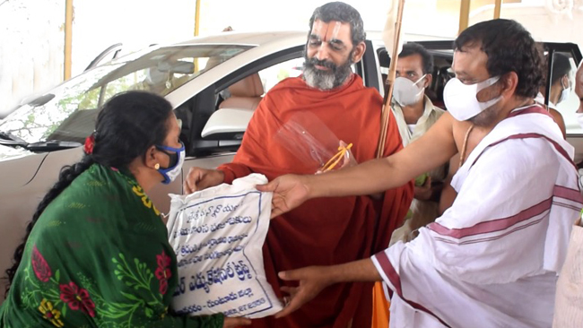 HH Swamiji distributes dry groceries to the needy at Vijaya Kiladri
