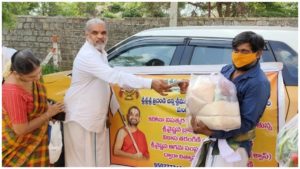Distributing privisions to 450 brahmin families